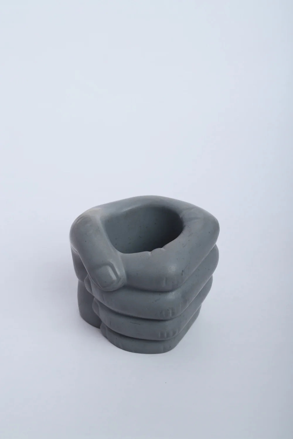 Fist Dark Concrete - Hand-shaped Decor- Pen stand and Pillar Candle Holder, featuring a clenched fist